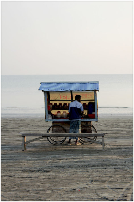 Man with his cart on the beach of Kuakata