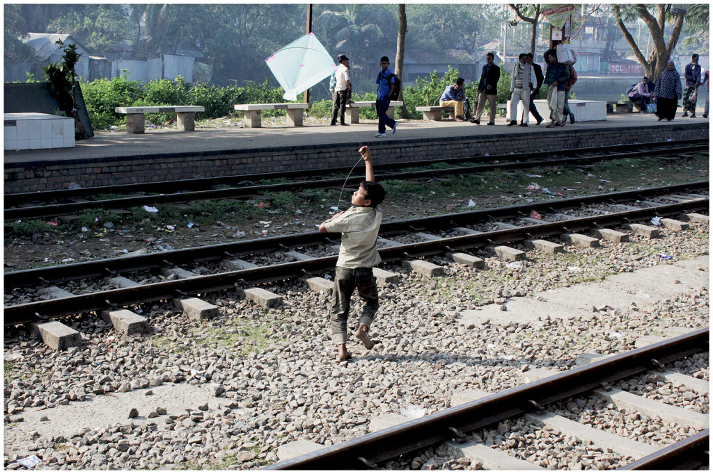 Young boy with a kit on the rail tracks on our way to Srimangal