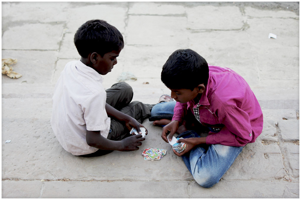 Kids playing on the river bank.