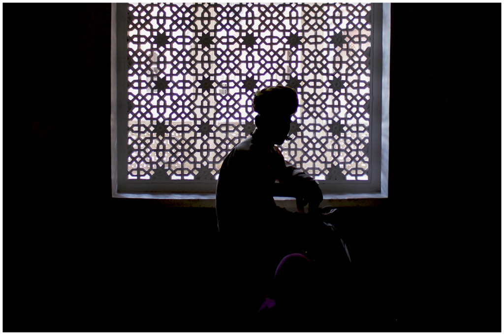 Guard inside the fort in front of some lace work