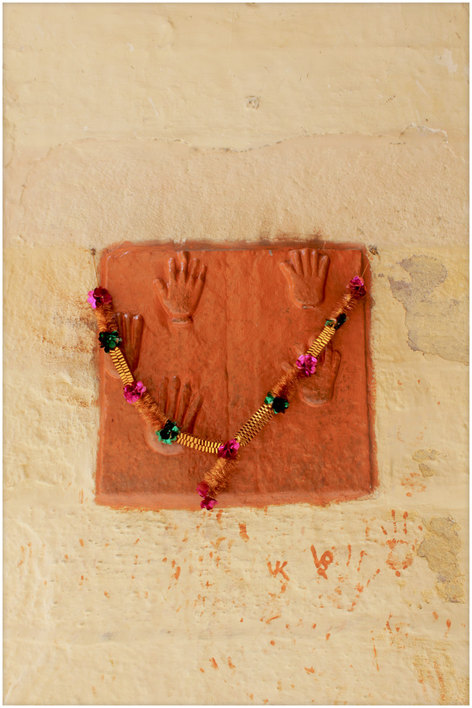 Hands of women who stept into the funeral fire of their men